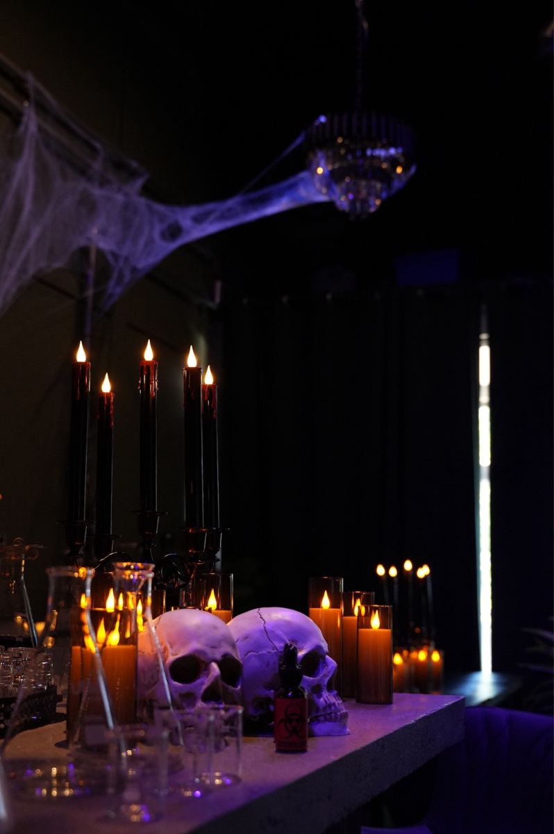 Candles and skulls on a shelf