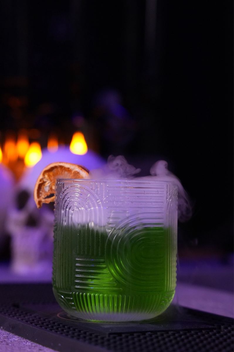 A smoking green potion cocktail