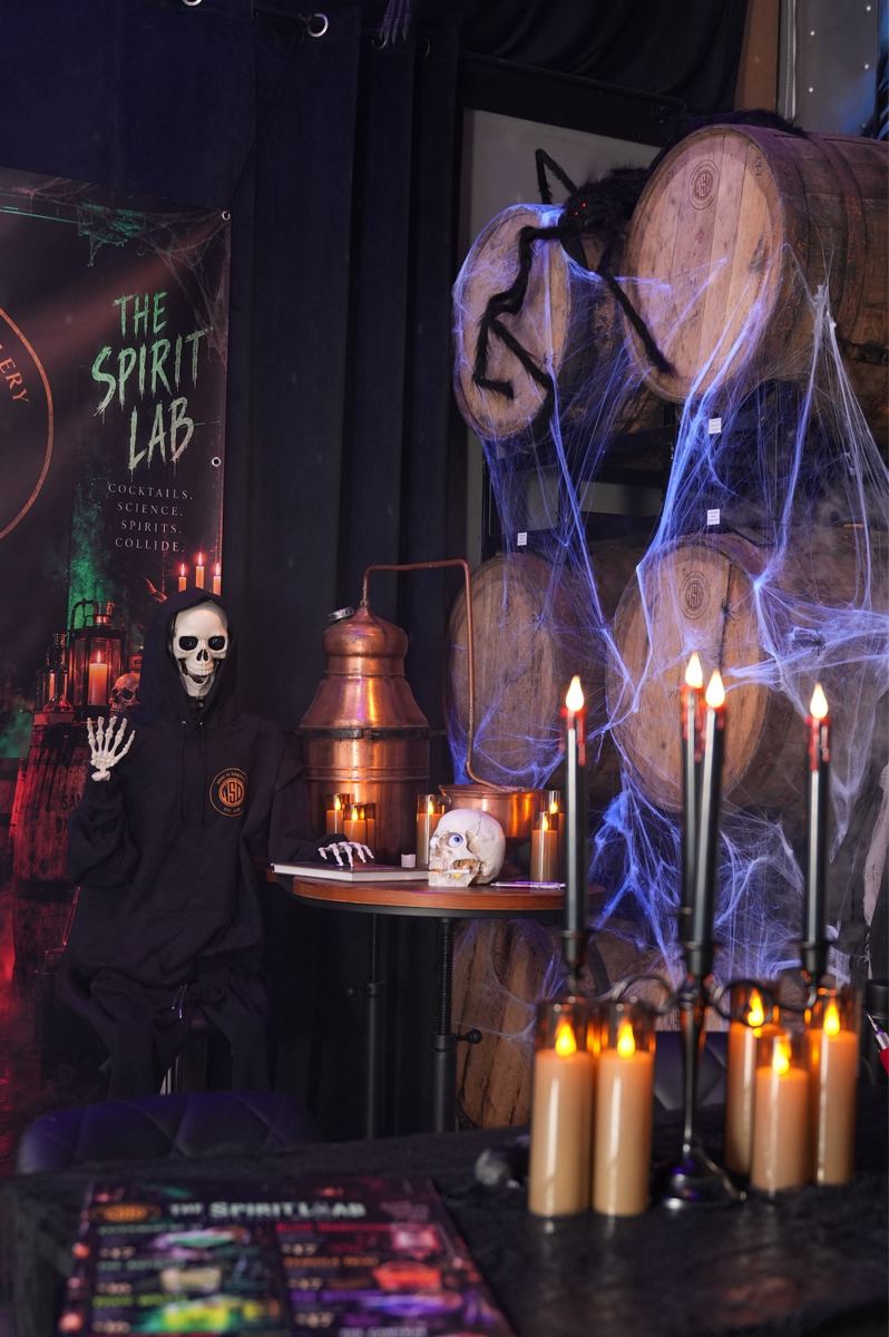 The Spirit Lab set: skeleton, candles, barrels and cobwebs under the Spirit Lab banner